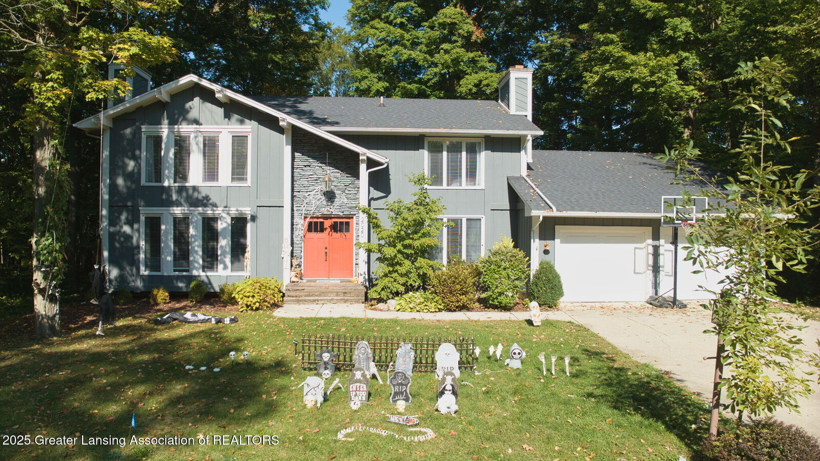 Property Photo:  2020 Tamarack Drive  MI 48864 