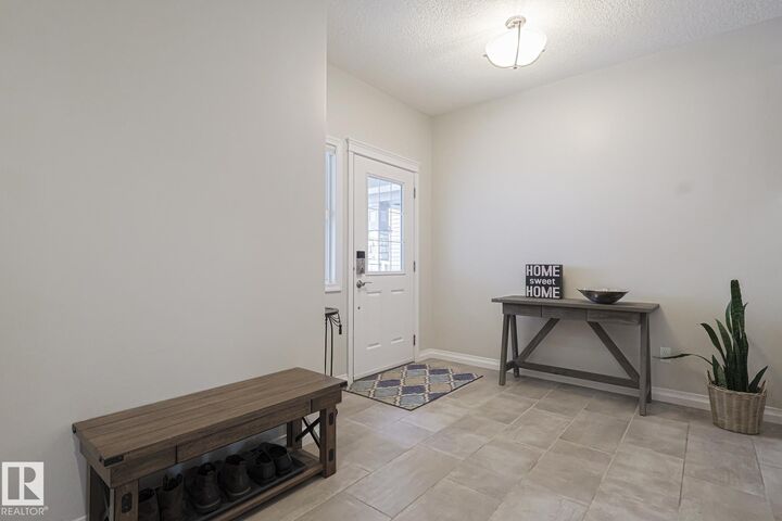 Property Photo:  128 Sandalwood Crescent  AB T8H 0S4 