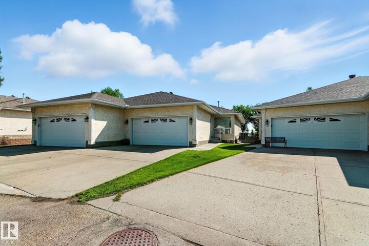 Property Photo: 14428 Miller Blvd NW 2 AB T5Y 2Y6