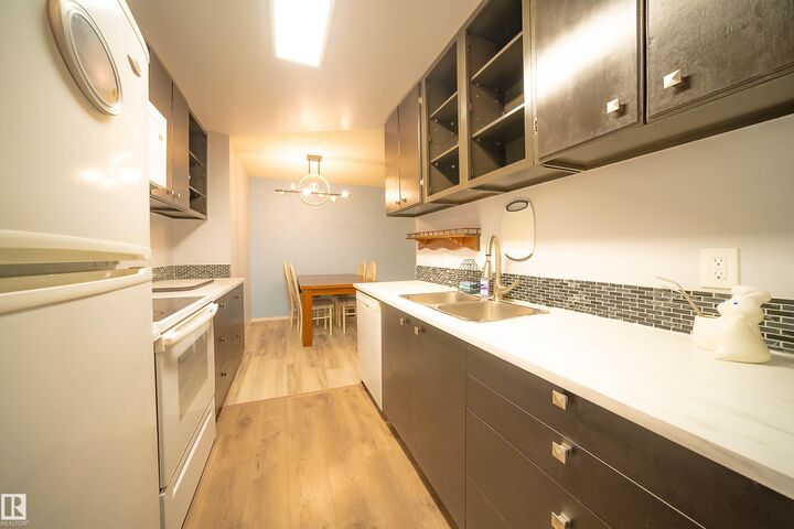 Property Photo:  10511 19 Avenue NW 408  AB T6J 5S8 