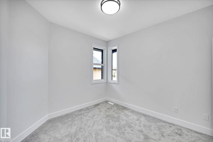 Property Photo: 104 Allard Link SW 24 AB T6W 2N2