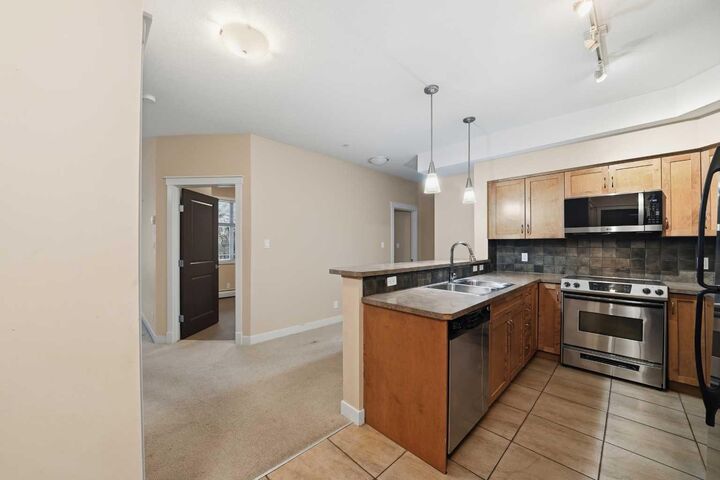 Property Photo:  100 Lakeway Boulevard 207  AB T4S 0A4 