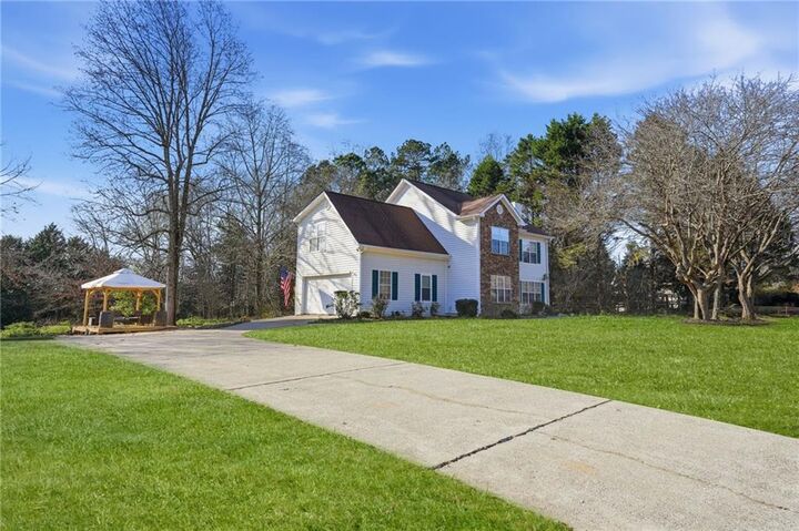 Property Photo:  7140 Hunters Trace Drive  GA 30028 