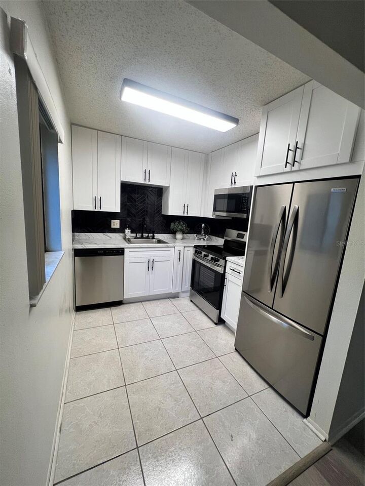 Property Photo:  11707 Raintree Village Boulevard C  FL 33617 