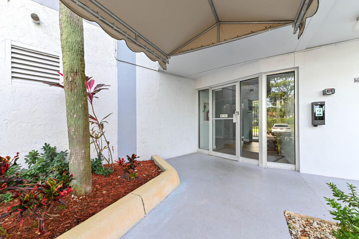 Property Photo:  198 NW 67th Street 207  FL 33487 