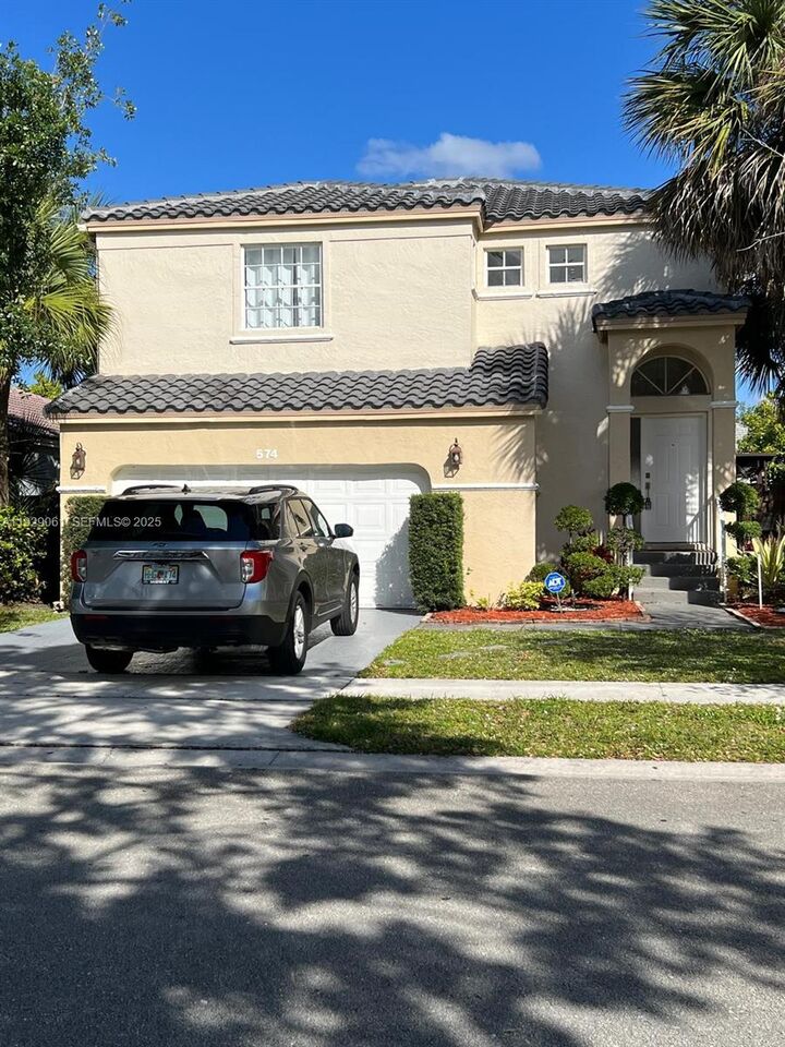 Property Photo: 574 NW 159th Ave FL 33028