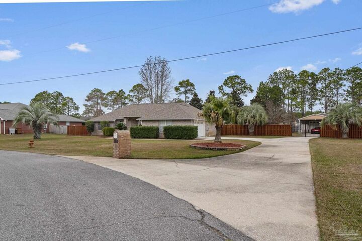 Property Photo:  5692 Als Way  FL 32583 