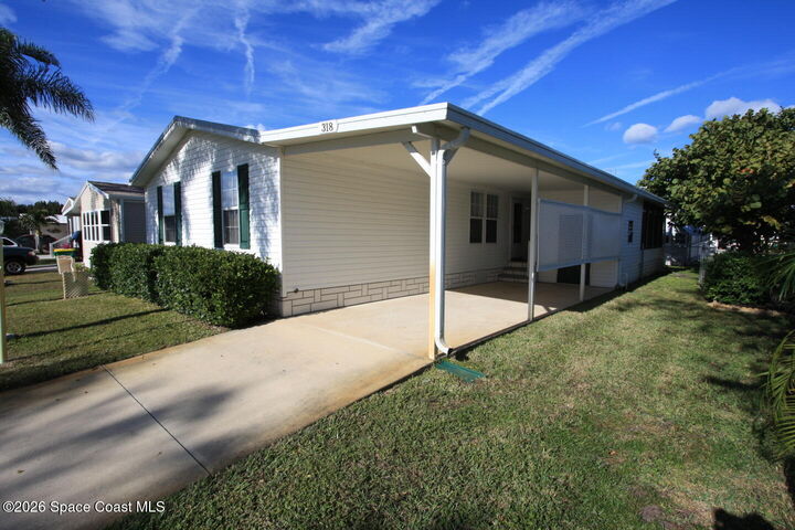 Property Photo: 318 Macadamia Drive FL 32976