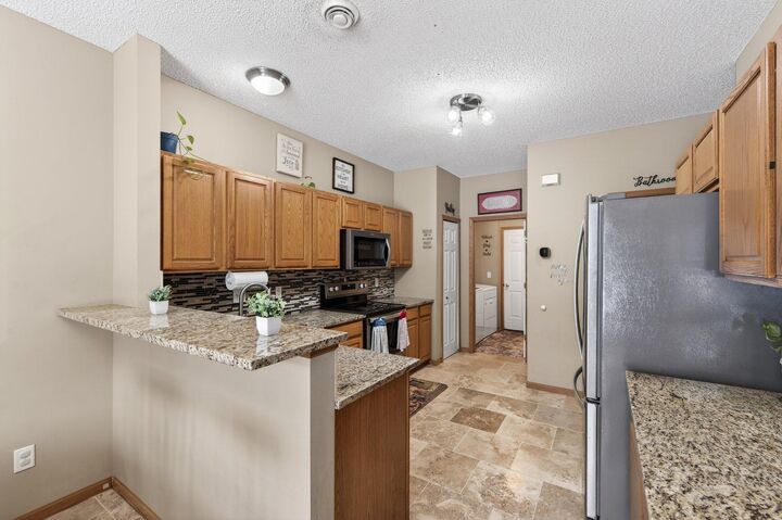 Property Photo:  6902 139th Lane NW 5  MN 55303 