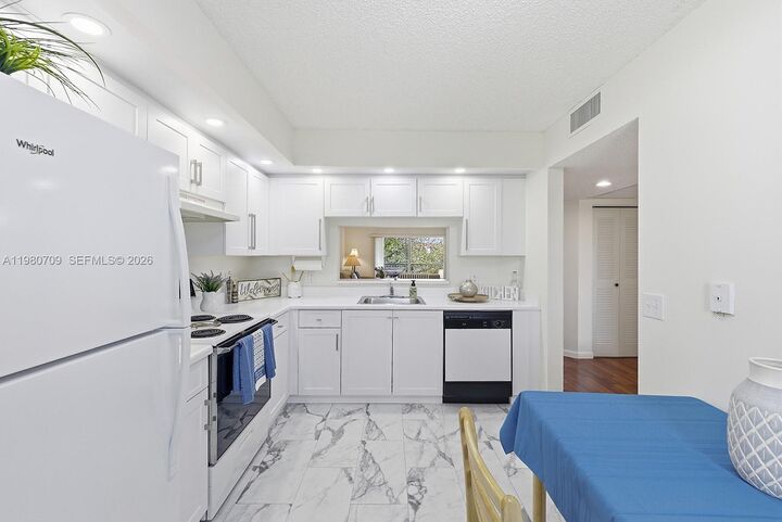 Property Photo:  1200 SW 137th Ave 308E  FL 33027 