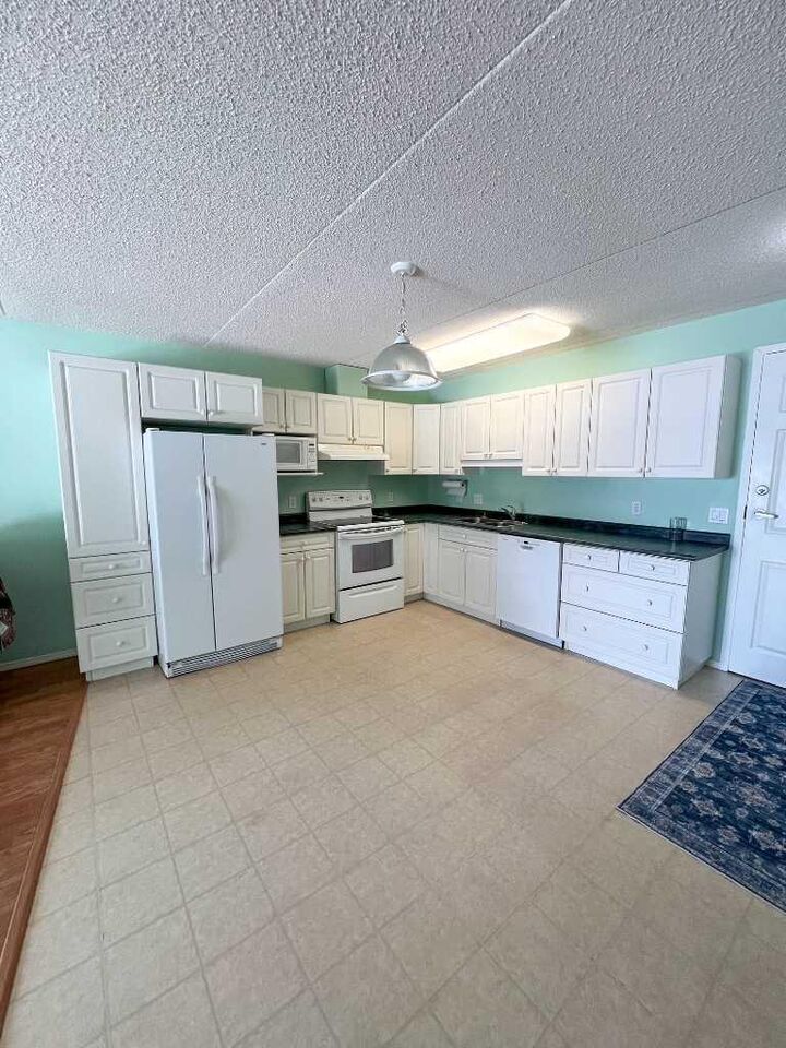 Property Photo: 777 48 Street 201 AB T7E 1Z6