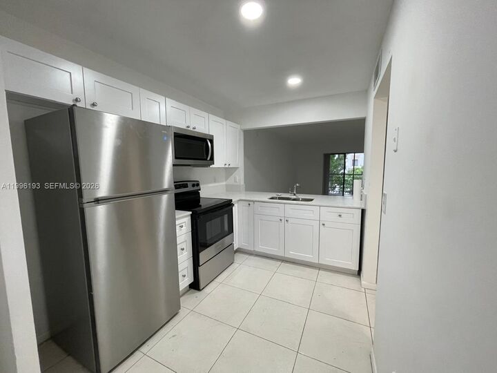 Property Photo:  861 NE 209th Ter 204-24  FL 33179 