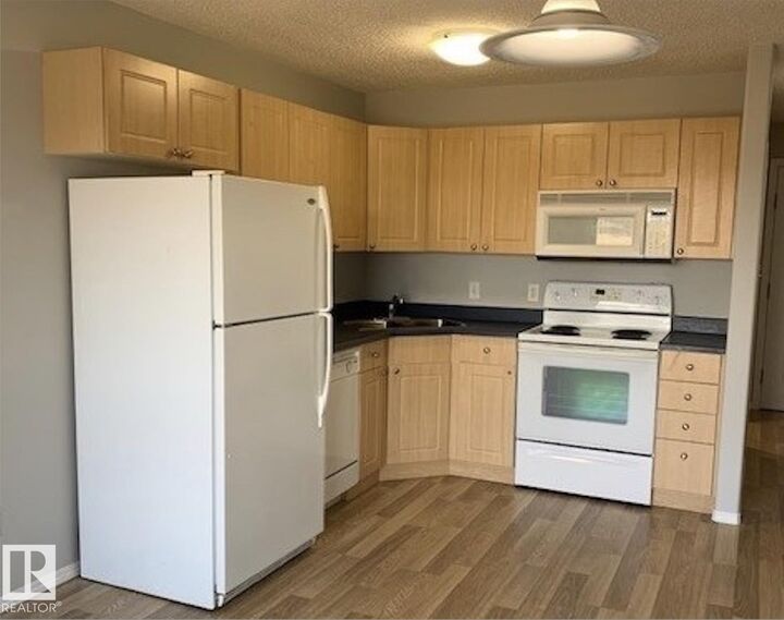 Property Photo: 70 Woodsmere 207 AB T8L 4R8