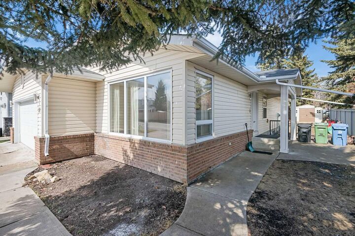 Property Photo:  51 Woodmont Road SW  AB T2W 4L6 