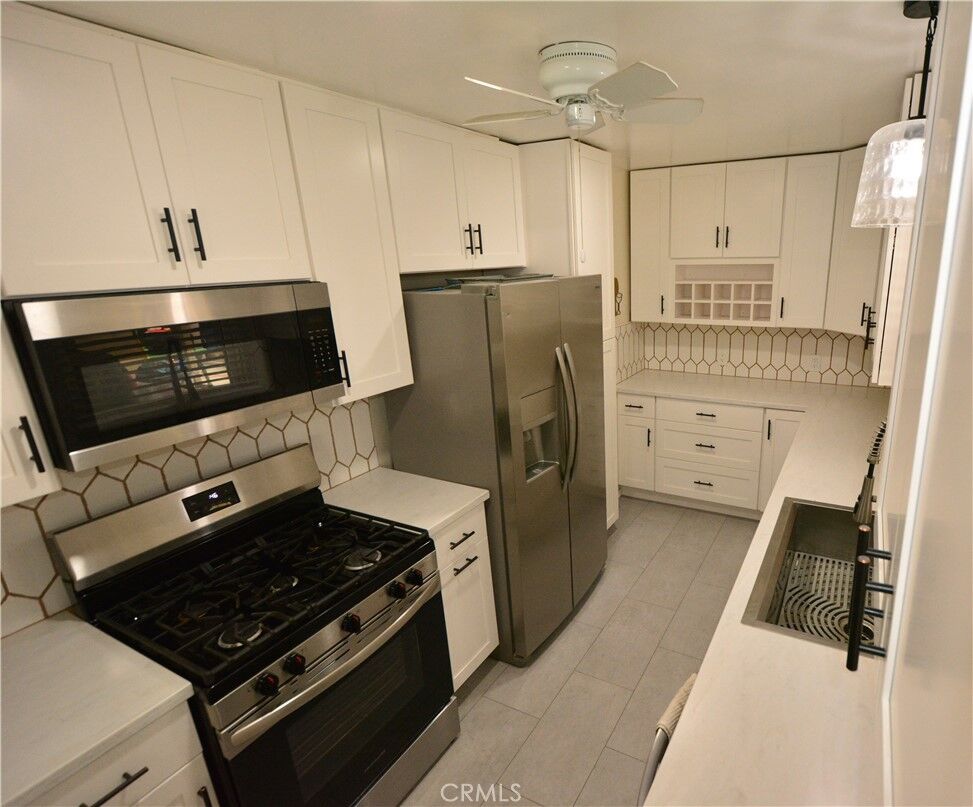 Property Photo:  8903 Songfest  CA 90660 