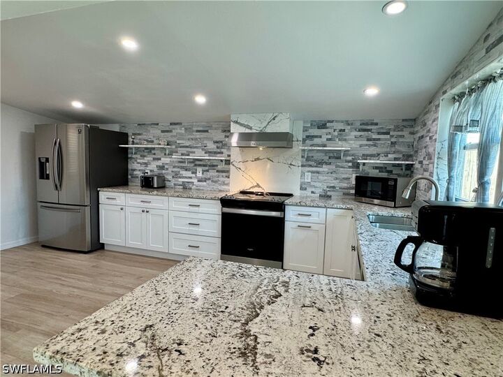 Property Photo:  829 107th Avenue N Unit 1  FL 34108 