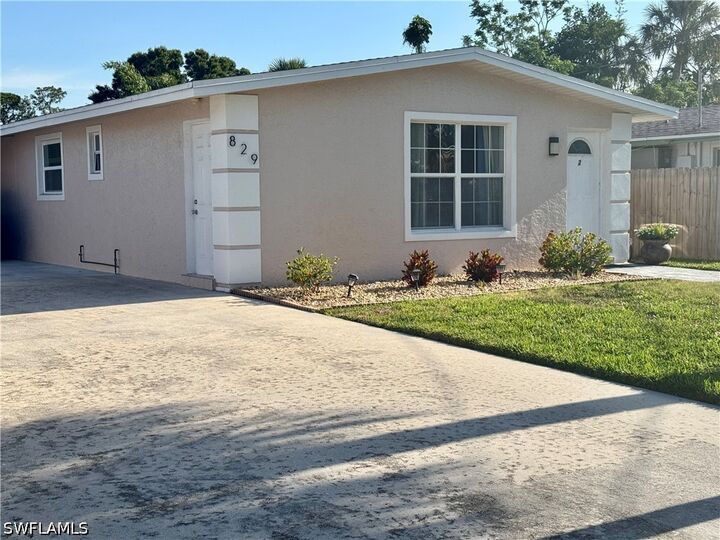 Property Photo: 829 107th Avenue N Unit 1 FL 34108