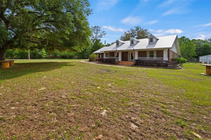 Property Photo:  6459 SE County Road 337  FL 32669 