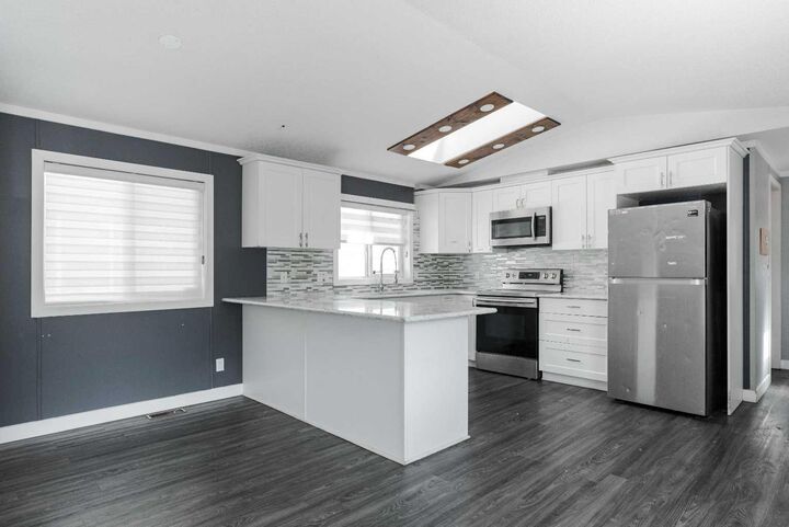 Property Photo:  216 Harpe Way  AB T9K 2K8 