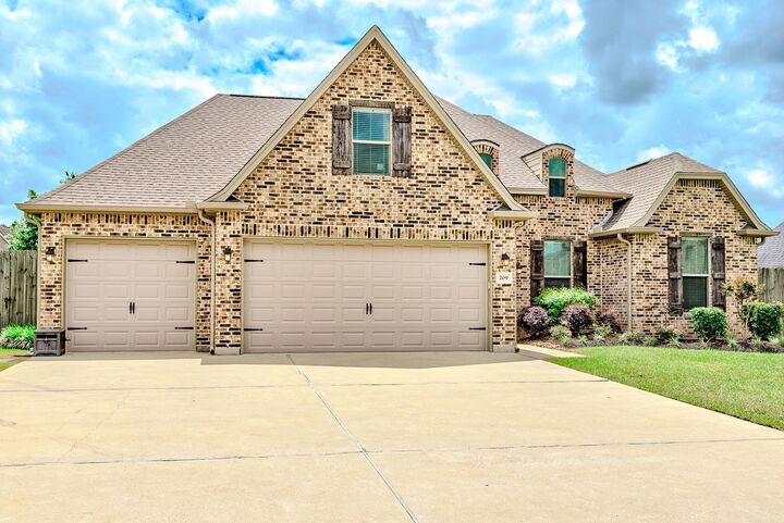 Property Photo:  209 Mandavilla Way  TX 77657 