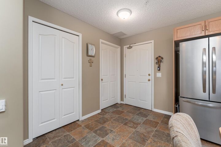 Property Photo: 16303 95 Street NW 221 AB T5Z 3V1