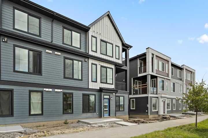 Property Photo: 60 Howse Lane 1104 AB T3P 2Z6