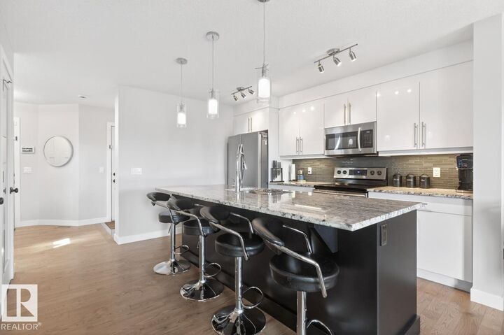 Property Photo:  7135 Cardinal Way SW  AB T6W 1Z3 