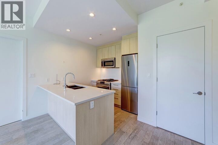Property Photo:  9060 University Crescent 1xx  BC V5A 0E1 