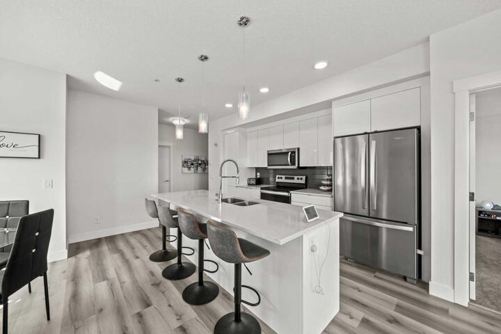 Property Photo: 19661 40 Street SE 305 AB T3M 3H3