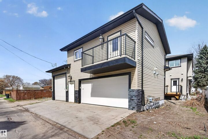 Property Photo:  10707-09 128 Avenue NW  AB T5E 0J4 