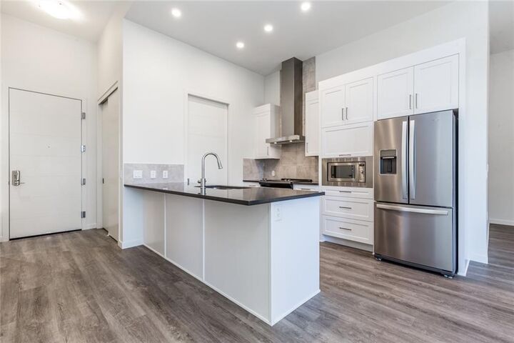 Property Photo:  12 Mahogany Path SE 109  AB T3M 3A4 