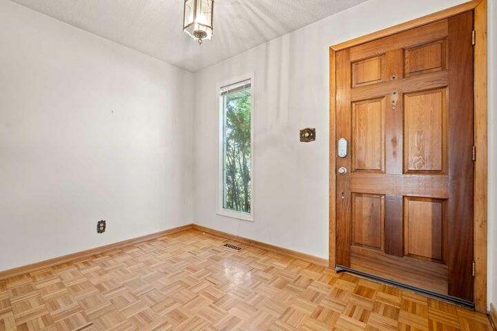 Property Photo:  5220 Grove Hill Road SW  AB T3E 4G6 
