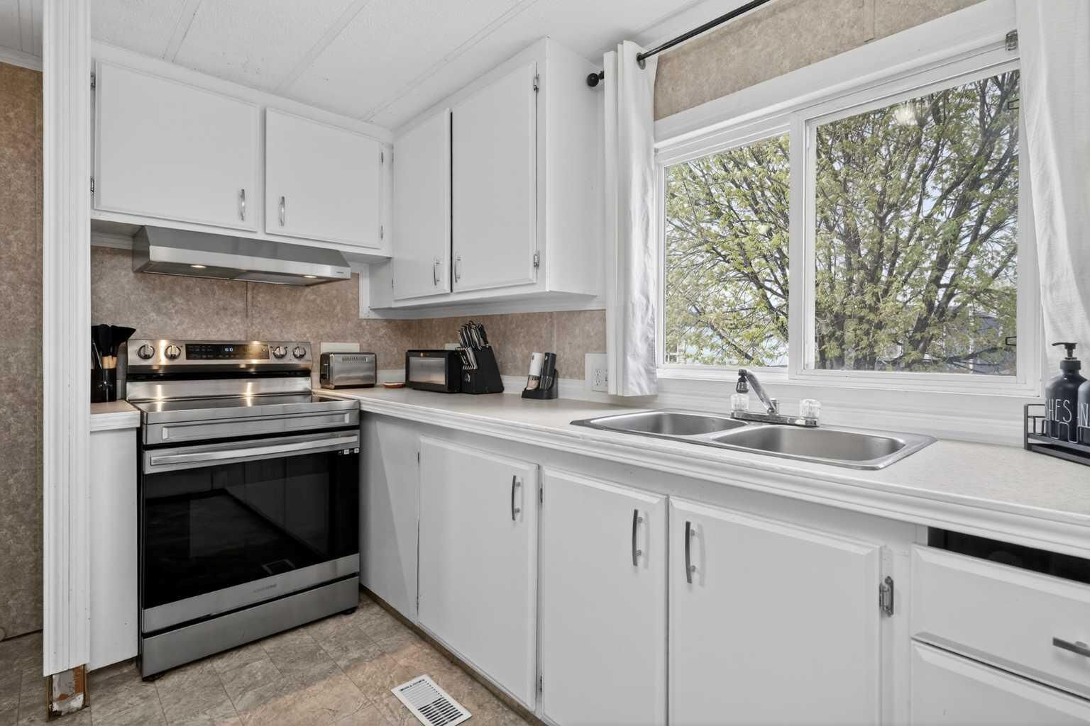 Property Photo:  6220 17 Avenue 328  AB T2A 7H4 