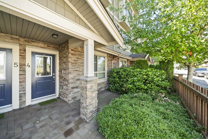 Property Photo: 19752 55A Avenue 4 BC V3A 3X2