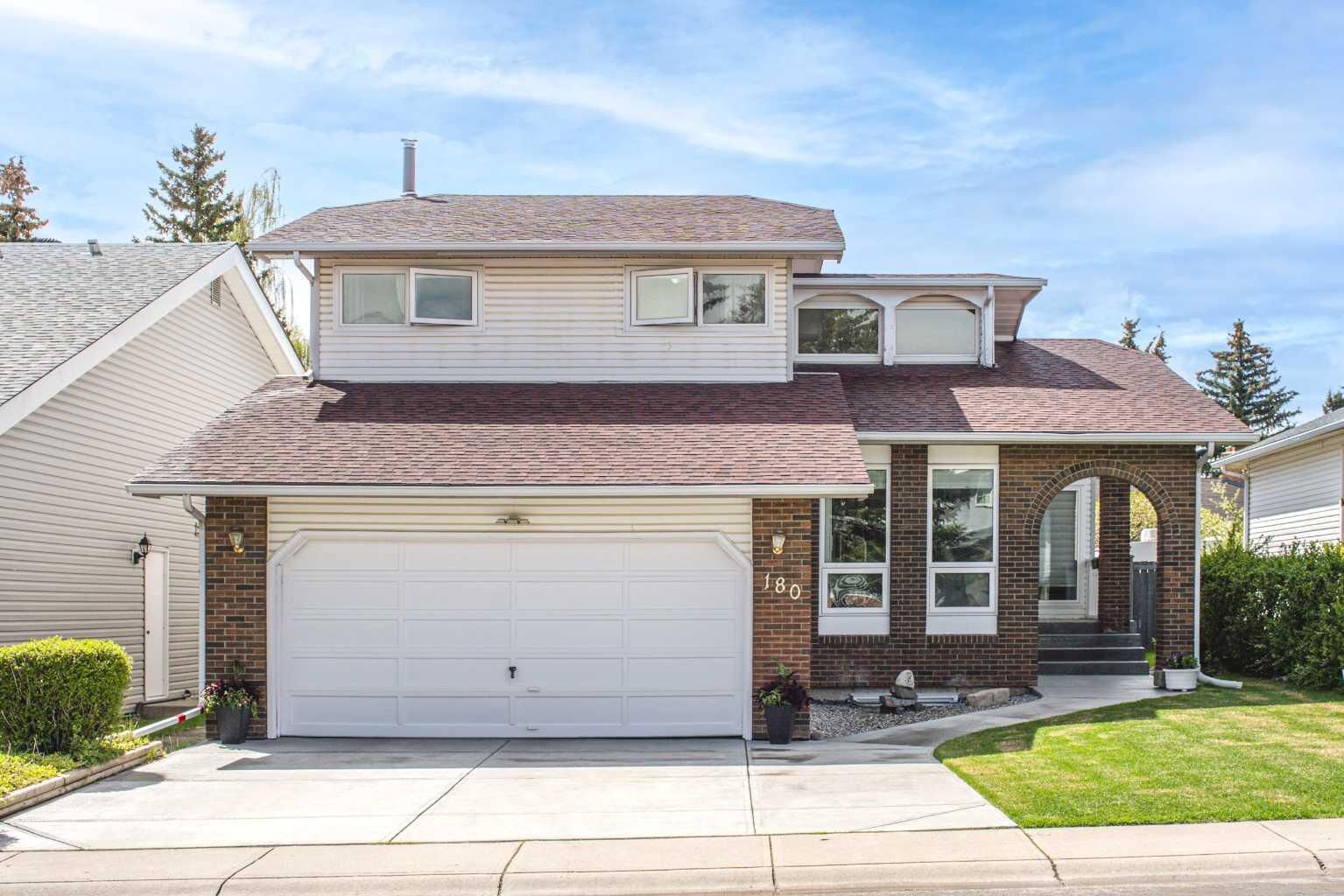 Property Photo: 180 Woodglen Way SW AB T2W 4T3