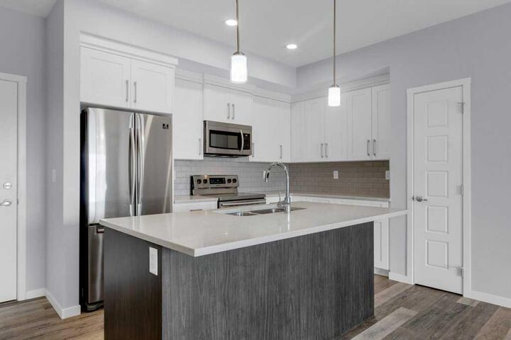 Property Photo: 4150 Seton Drive SE 323 AB T3M 3C7