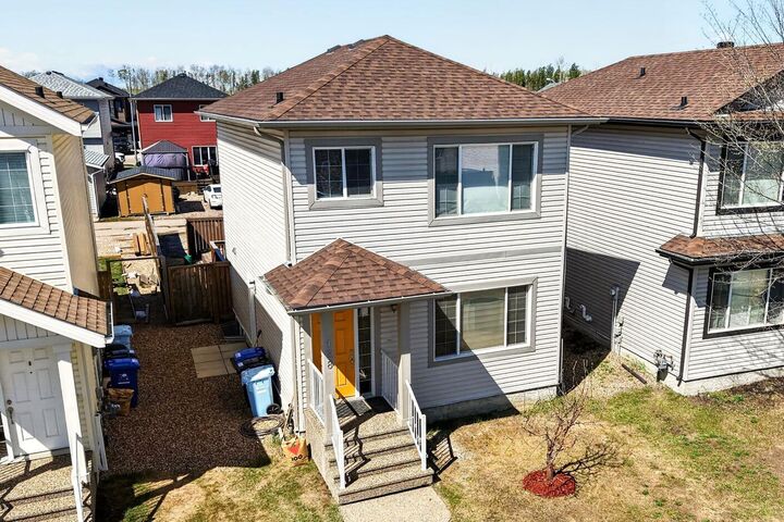 Property Photo:  128 Juniper Street  AB T9K 0M8 