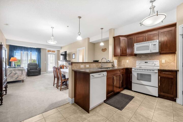 Property Photo: 2330 Fish Creek Boulevard SW 2303 AB T2Y 0L1