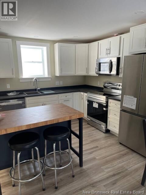 Property Photo: 67 Dewitt Acres NB E3A 6S3
