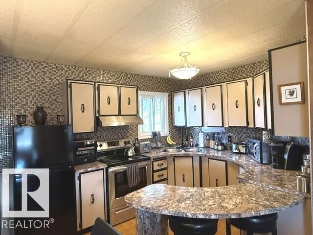 Property Photo: 46 Oakridge Drive NW AB T6P 1H1