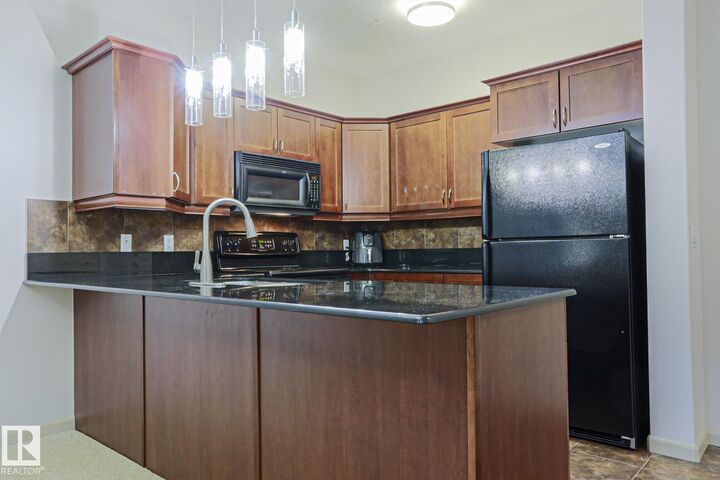 Property Photo: 160 Magrath Road NW 117 AB T6R 3T7