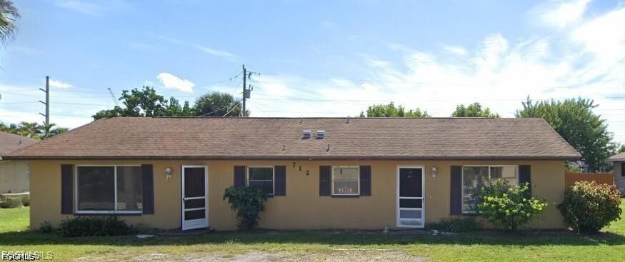 Property Photo:  712 SE 47th Street Left Side  FL 33904 