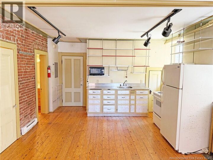 Property Photo:  157 Princess Street Unit# 1  NB E2L 1K8 