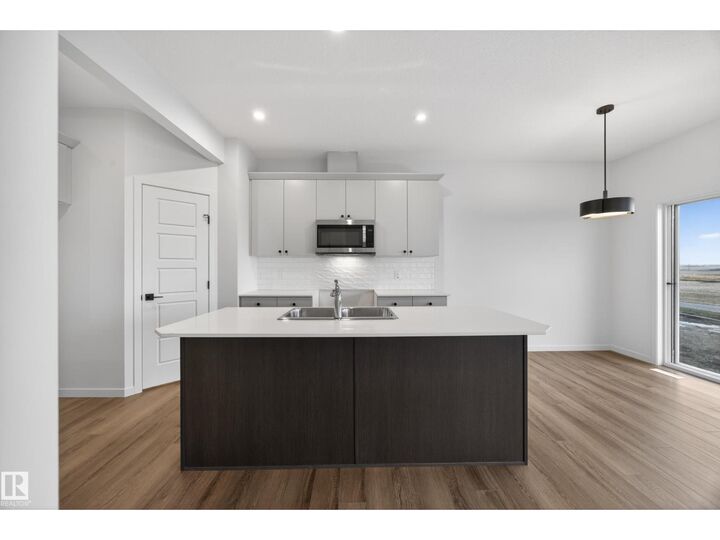 Property Photo: 116 Honeysuckle Gr AB T9E 0V1