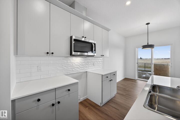Property Photo: 116 Honeysuckle Green AB T9E 0V1