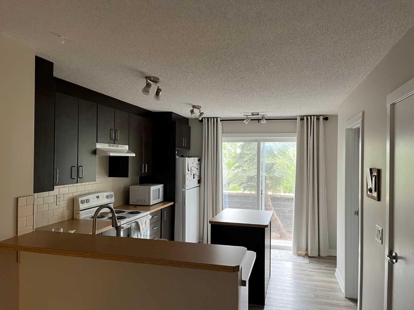 Property Photo: 2445 Kingsland Road SE 303 AB T4A 0B4