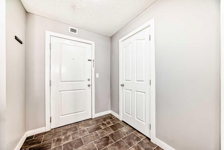 Property Photo: 403 Mackenzie Way SW 4304 AB T4B 3V7