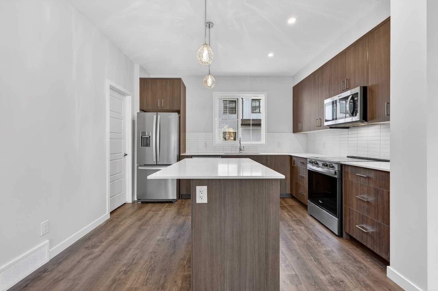 Property Photo: 40 Creekside Way SW 105 AB T2X 6E2
