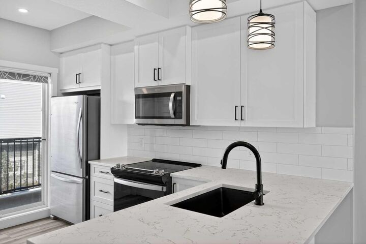 Property Photo:  115 Sagewood Drive SW 703  AB T4B 4V6 
