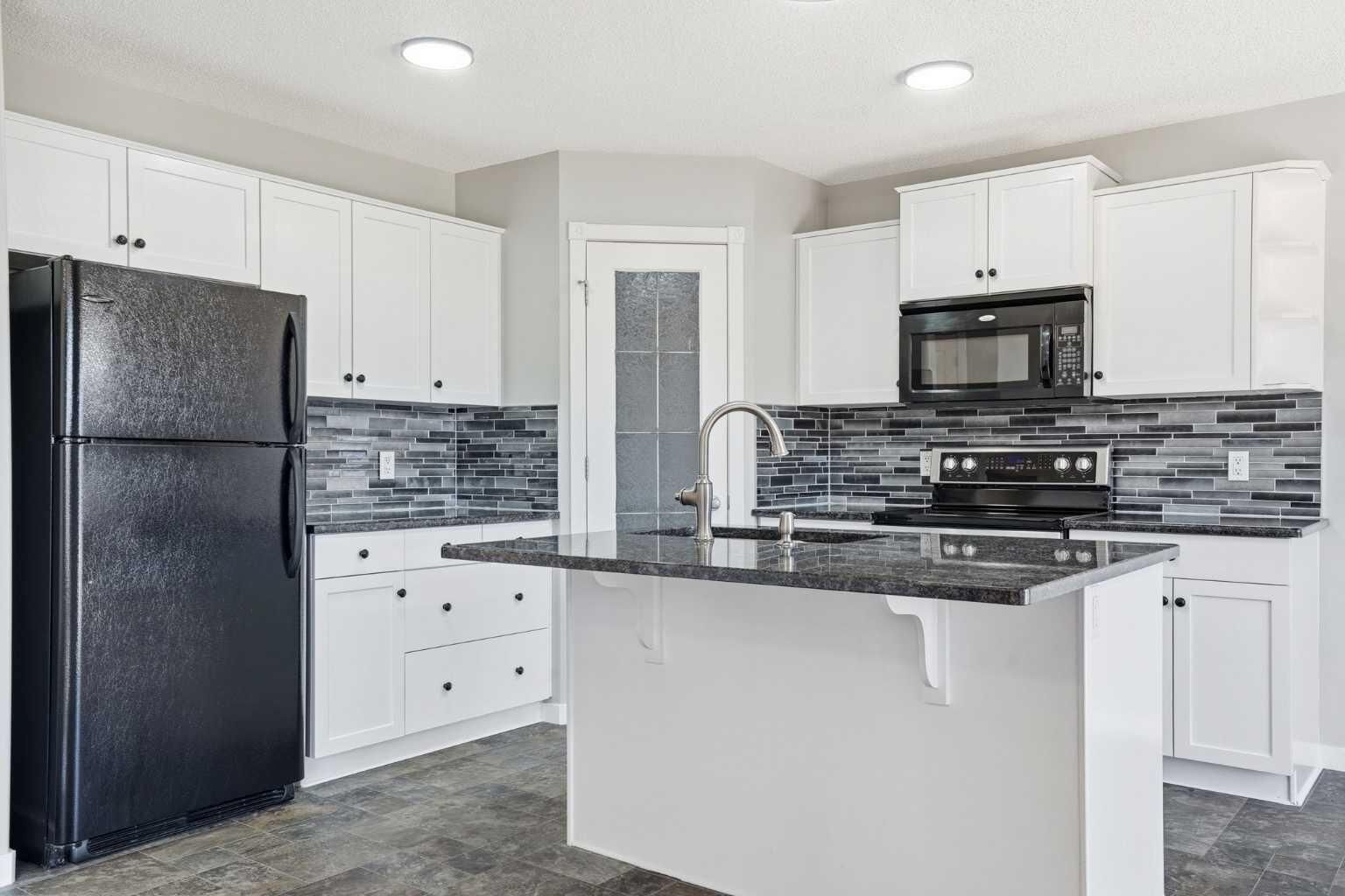 Property Photo: 207 Sagewood Drive SW AB T4B 3B3
